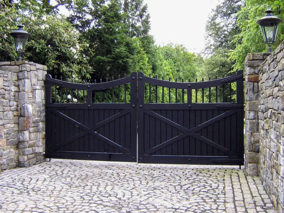 black wrought iron driveway gate repaired