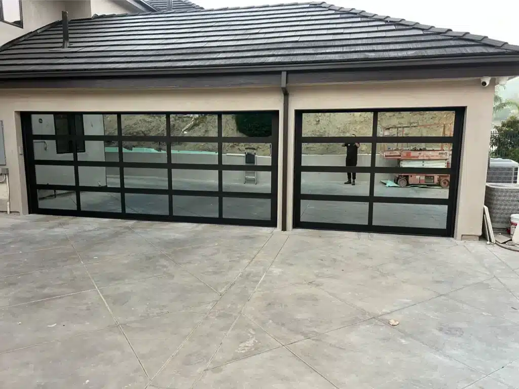 modern glass garage door on display, wide enough to fit 2 cars