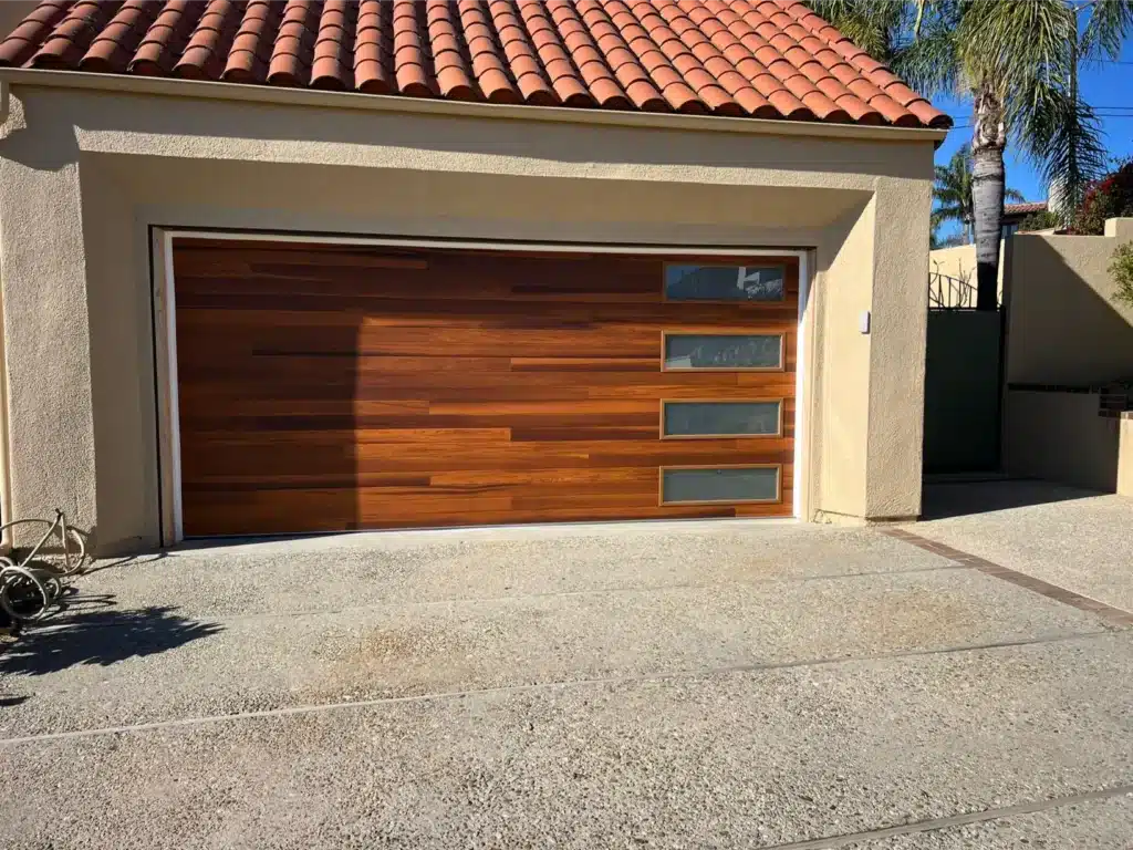 modern garage door made of wood with glass accents