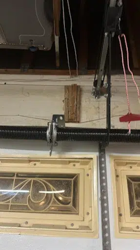 Signs You Need Garage Door Torsion Spring Replacement Services